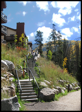 stairs leading up to one of the condos along the creek