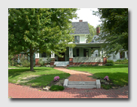 A lovely house set at an angle on a corner lot